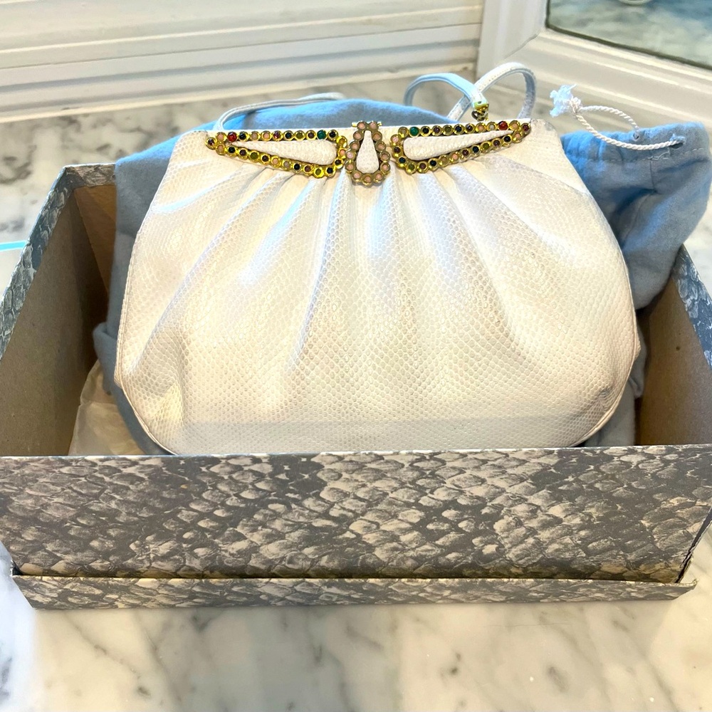 Authentic Judith Leiber White Clutch  with shoulder strap.